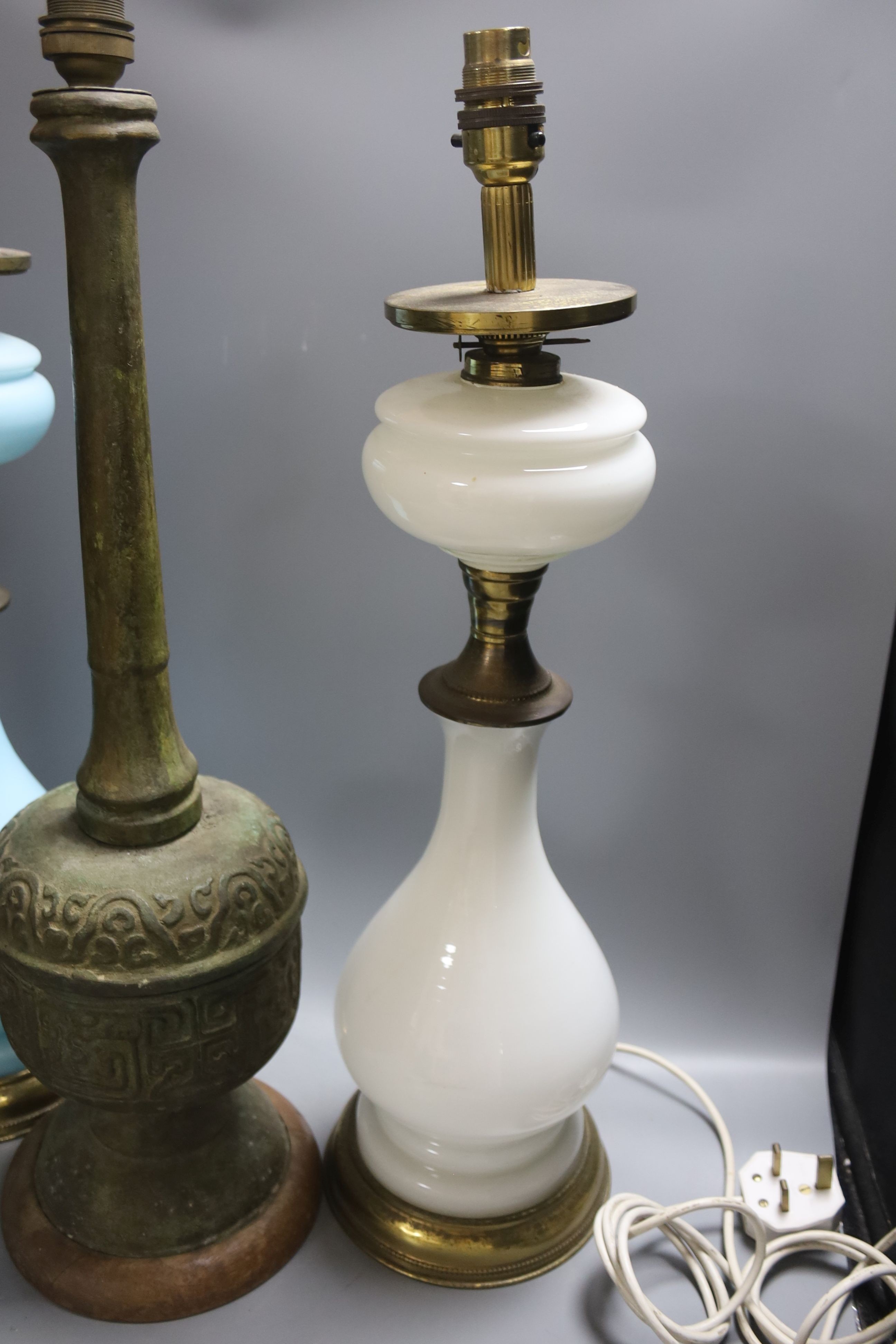 A pair of Victorian Opaline glass table lamps, 55cm high and archaistic brass table lamp